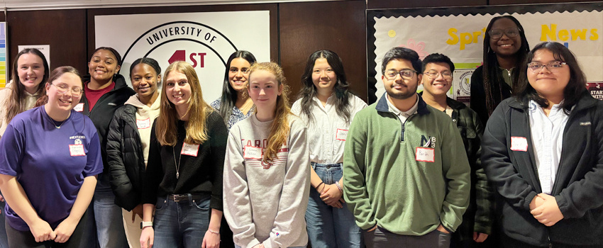 First-Gen Student Advisory Board group photo taken in the Maxcy College lobby