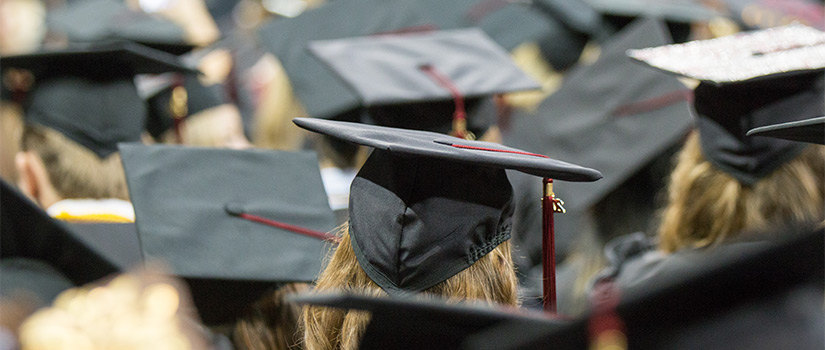 students in graduation hats