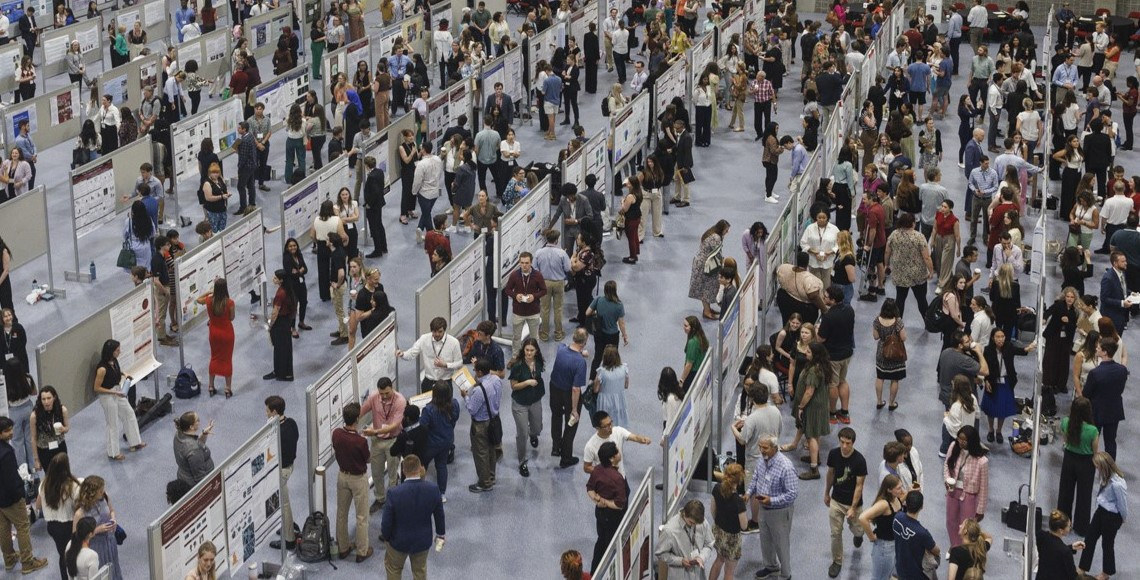 an overhead photo of students presenting posters at Discover USC