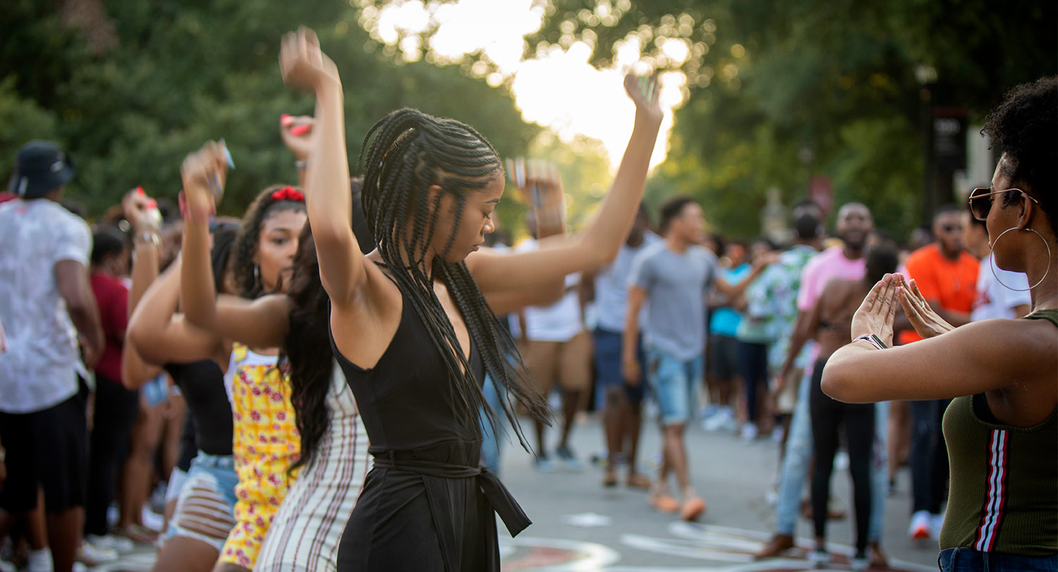 Students gathered on Greene Street dancing and having a good time.