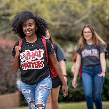 Studnets walking around outside campus. 