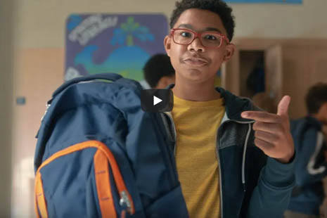 black student holding backpack