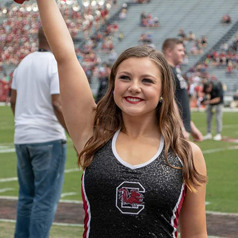 Delnoce cheering on the sidelines.