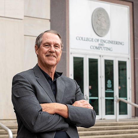 Sutton stands in front of the Swearingen building.