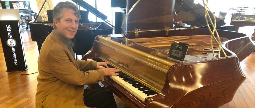 Banner Image David Cutler playing ornate piano