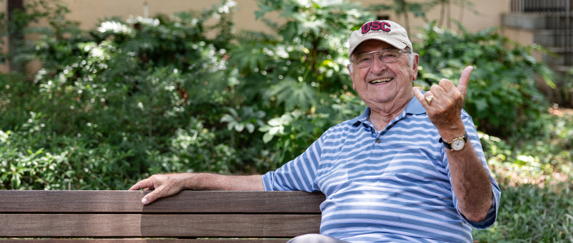 Stan Papajohn sitting on a bench