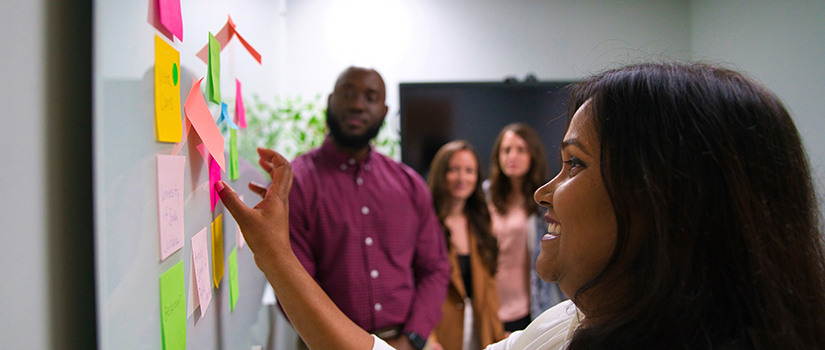 People sitting in a conference room holding a meeting