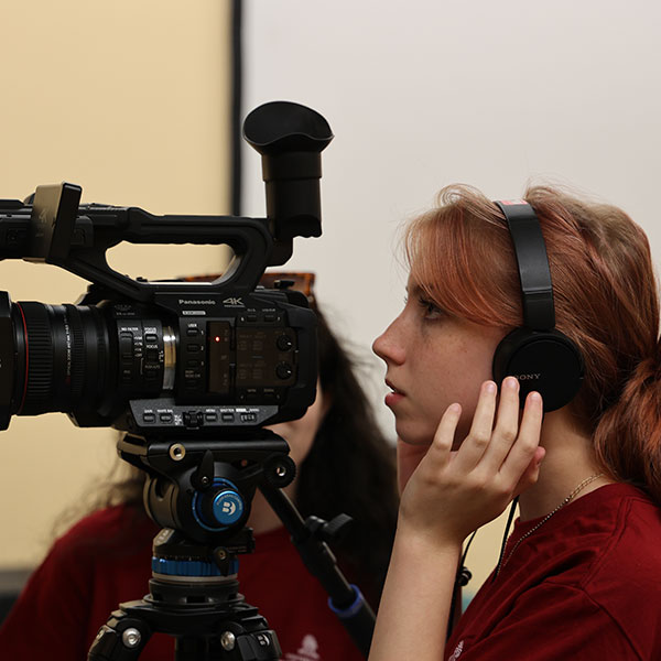 Female student using a camera