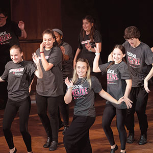 Kids on stage performing 