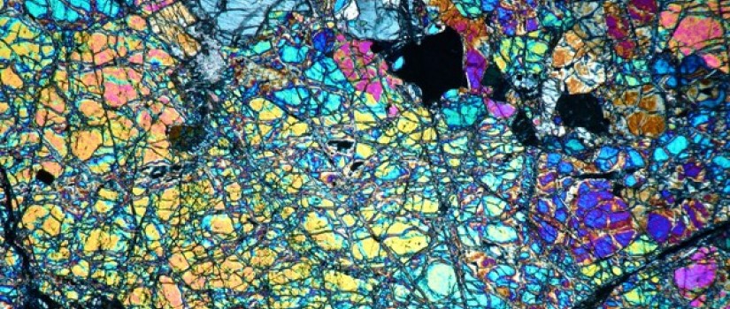 Decorative banner showing a mass spectrometry photo of a thin section of peridotite taken by the Center for Elemental Mass Spectrometry.