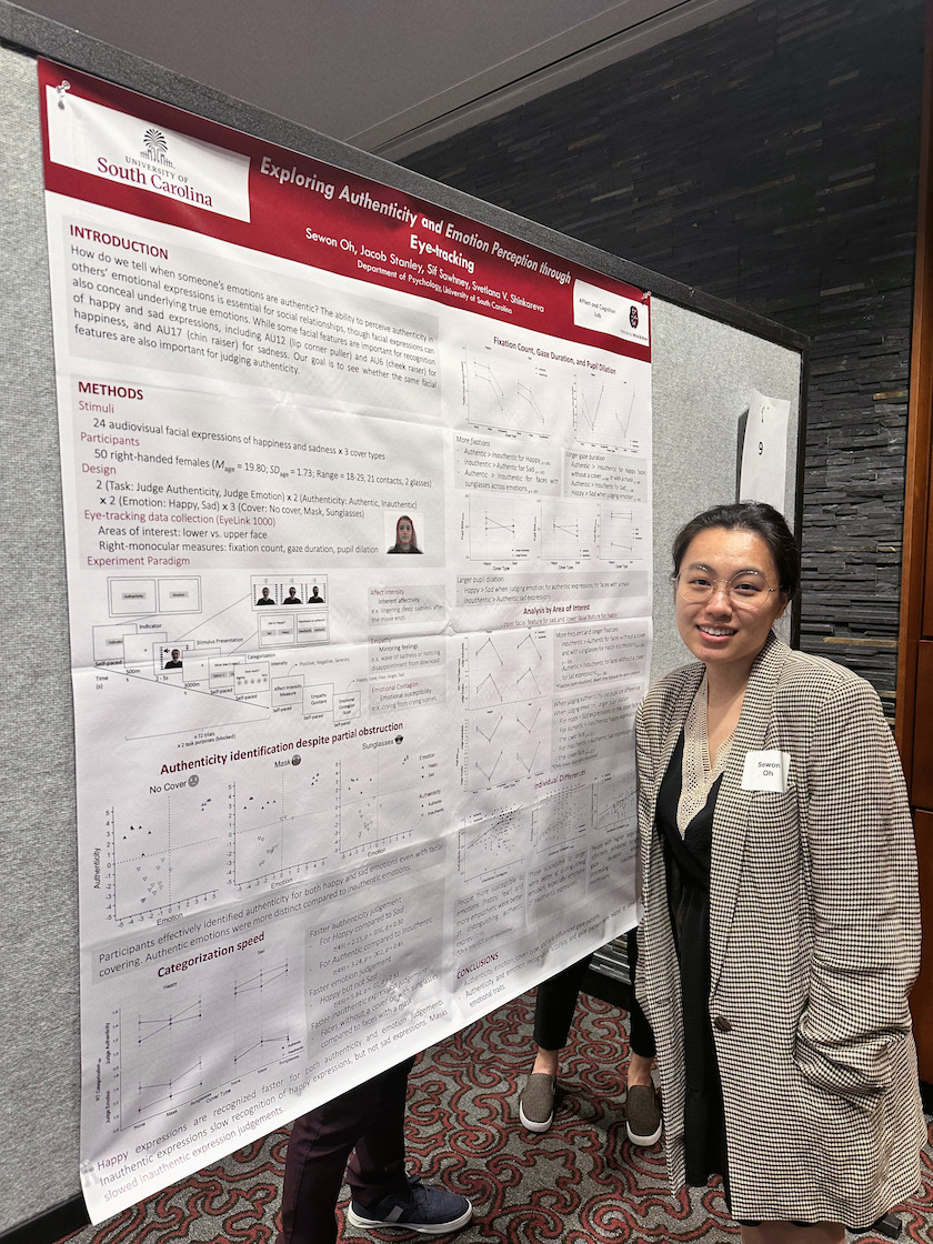 Graduate Student Sewon Oh stands in front of her paper