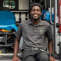 Tremayne Ansani sits on his ambulance