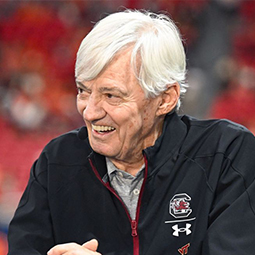 Photo of Coach Frank Beamer wearing a gamecock jacket. 