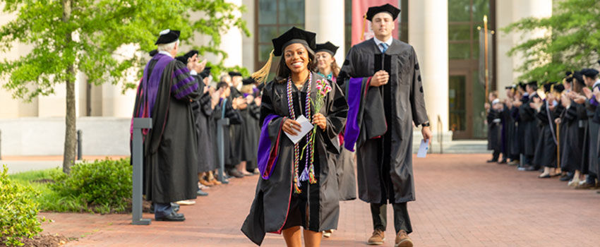 Class of 2024 graduates processing to commencement exercises