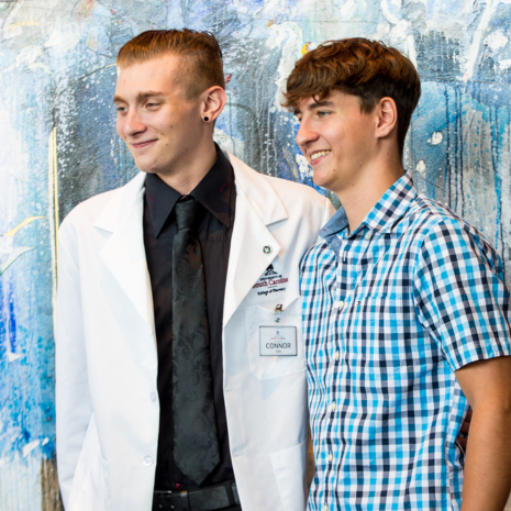 Fry in white coat with friend