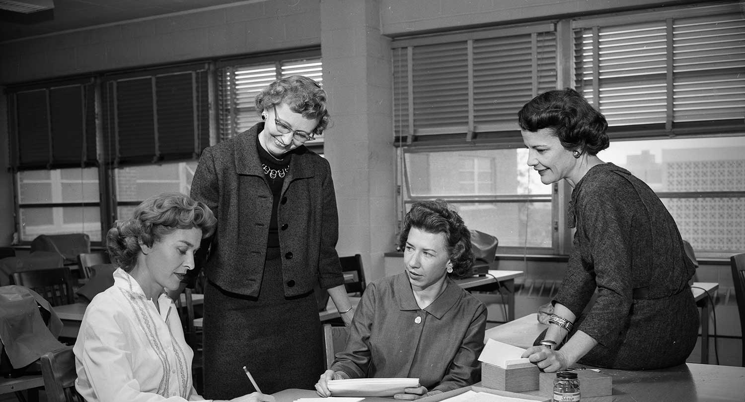 Ada B. Thomas talks with students on campus.