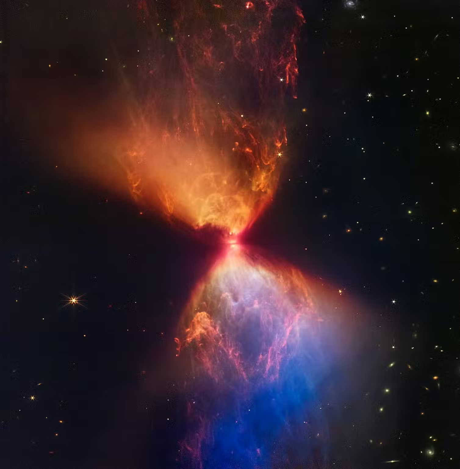 Two bright clouds of gas condensing around a small central region