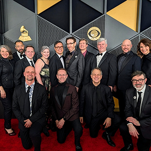 Group in formal wear on a red carpet