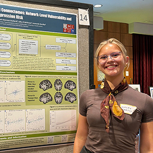 Ansley Martin stands next to her poster titled 