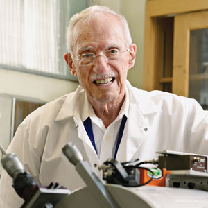 Frank Avignone in his campus laboratory with the Thomas F. Jones Memorial Electron Spectrometer.
