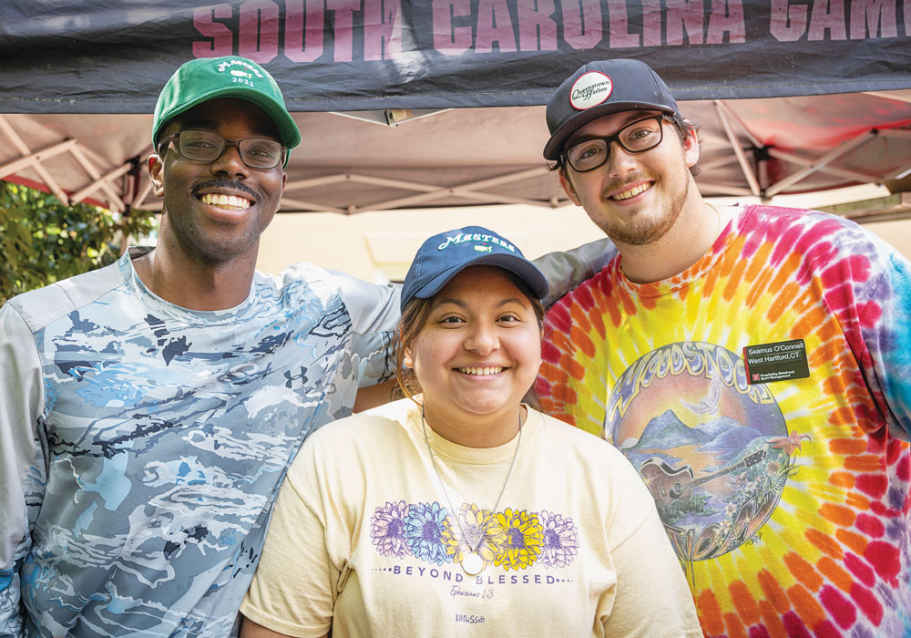 Three hospitality management majors who work in the Garden Grill smile for the camera.