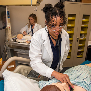 Jessica Baldwin works on in the nursing simulation lab.