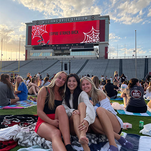Lydia Stoehr with friends on the field at Williams-Brice Stadium