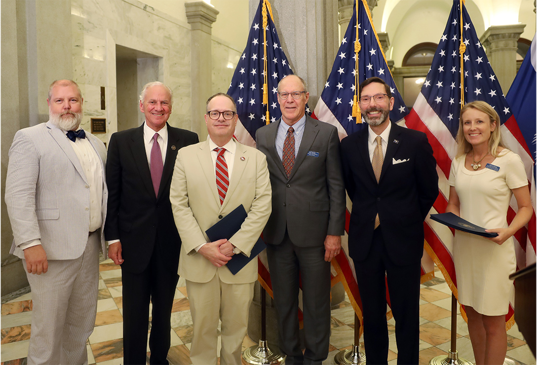 Lead architect Jay White, Gov. Henry McMaster, University Libraries dean David Banush, Conservation South Carolina board member John Hildreth, S.C. Department of Archives and History director, state historic preservation officer and state archivist W. Eric Emerson and Joanna Rothell, director of outreach and preservation for Preservation South Carolina pose together after the award presentation.