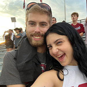 Raina Mills and boyfriend celebrate in stands at Williams-Brice stadium.