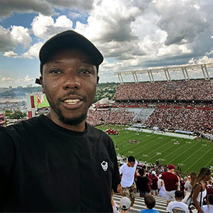 Louis Berko stands in Williams-Brice Stadium during a football game.
