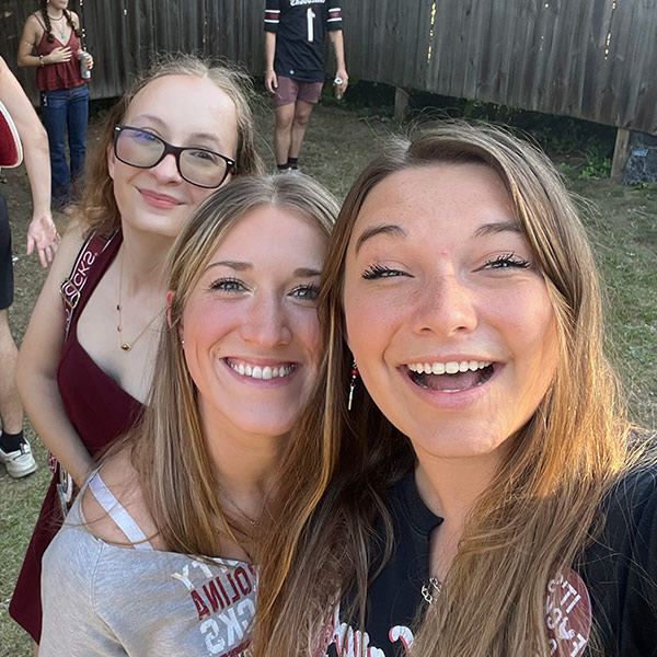 Kaitlyn Williams and two friends outdoors